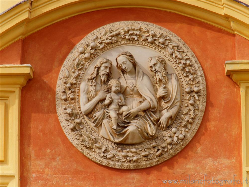 Magnano (Biella, Italy) - Round above the main entrance to the parish church of the Saints Baptist and Secondus